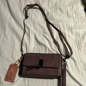 Small purse with double zipper. Brand new!
